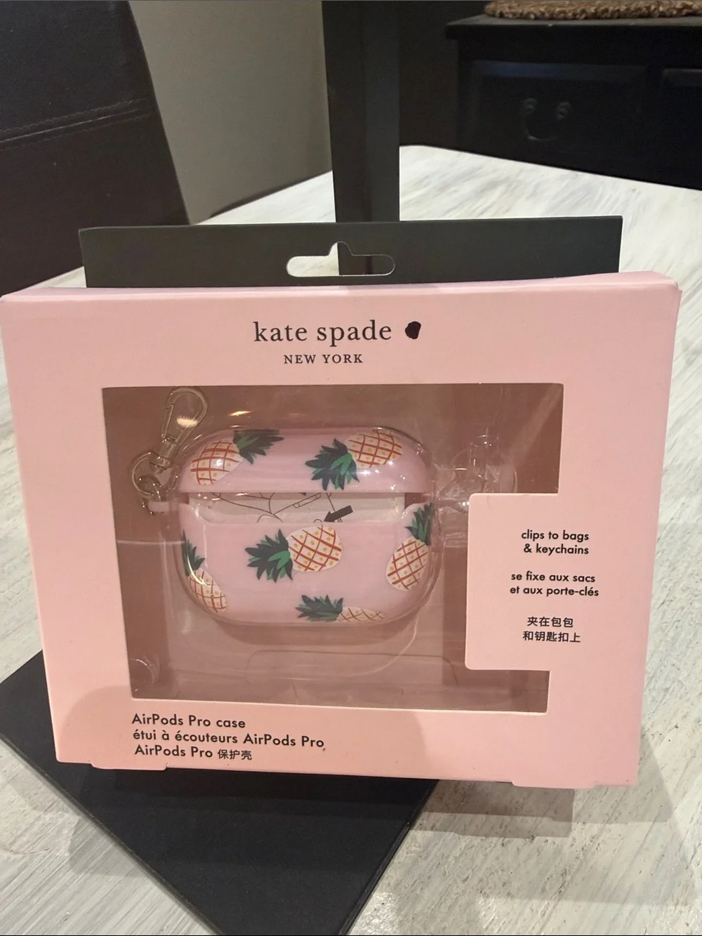 kate spade pink pineapple AirPods Pro case with green leaves and gold clip